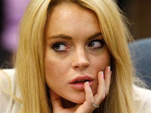 Photo of Lindsay Lohan with hand on lip